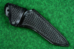 "Taranis" professional grade tactical, counterterrorism, rescue knife, sheathed view. Large flap retains knife with complete coverage, black oxide stainless steel dot snap retention
