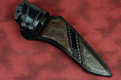 "Taranis" sheathed view, leather sheath inlaid with buffalo (bison) skin. Sheath has double snap flap retention for security with blackened stainless steel snaps