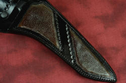 "Taranis" sheath front inlay detail. Large panels of bison skin are durable and tough, inlaid in hand-carved and dyed heavy leather shoulder