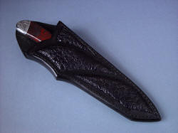 "Tharsis Intense" sheathed view. Sheath is deep and protective in heavy leather shoulder and frog skin inlays