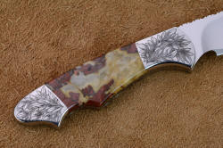 "Thuban" Three power enlargement of reverse side handle detail. Handle is golden-red brecciated jasper gemstone from Africa, bolsters are finely engraved stainless steel