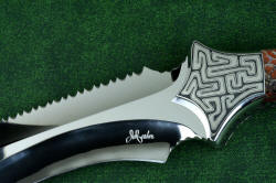 "Titan" karambits, fine handmade custom knives, maker's mark detail. Mark is engraved into super-hard blade with diamond
