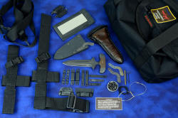 "Vindicator" push/punch counterterrorism tactical defensive dagger: Entire knife kit shown with two sheaths, all mounting and wearing  hardware, belt loop extenders, sternum harness, sheath springs, flashlight accessory, sharpener and case, and heavy duffle 