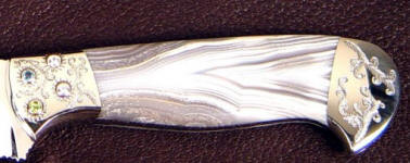 White geodic agate gemstone knife handle, faceted gemstones set in stainless steel bolster