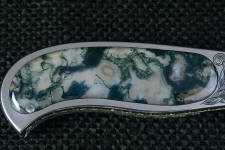 Hard and glassy, Indian Green Moss Agate with bits of crystal inclusions and hard cryptocrystalline quartz takes a glassy polish