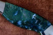 Translucent, clear, and mossy green areas of Indian green moss agate gemstone knife handle