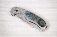 Indian Green Moss Agate is transparent in thin sections, shown on this linerlock folding knife handle inlay