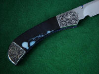 Black and white moss agate gemstone knife handle is tough and hard on this folding knife