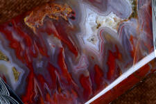 Sonoran Flame Agate has crystal pockets and translucent and transparent areas of bold natural color