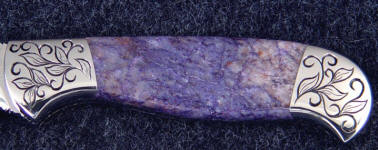 Dumortierite is an unusual purple gemstone with small orange-brown flakes