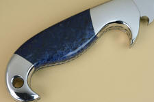 Dumortierite can be very dark blue, and is the hardest, toughest naturally blue gemstone appllicable for knife handles