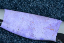 Turkish jade is naturallly purple, and a mixture of several different types of stone, but mainly jade