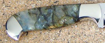 Labradorite has irridescence, prismatic light play, and even metallic sparkles of color called Labradoressence