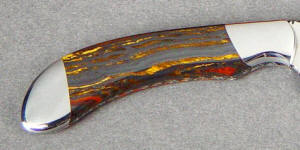Tiger eye is silicified (quartz) crocidolite with a silky, chatoyant stucture. 