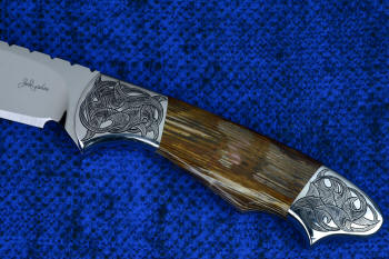 "Thuban" obverse side view in CPM154CM high molybdenum powder metal technology stainless tool steel blade, hand-engraved 304 stainless steel bolsters, Australian Petrified Wood gemstone handle, hand-carved, hand-dyed leather sheath