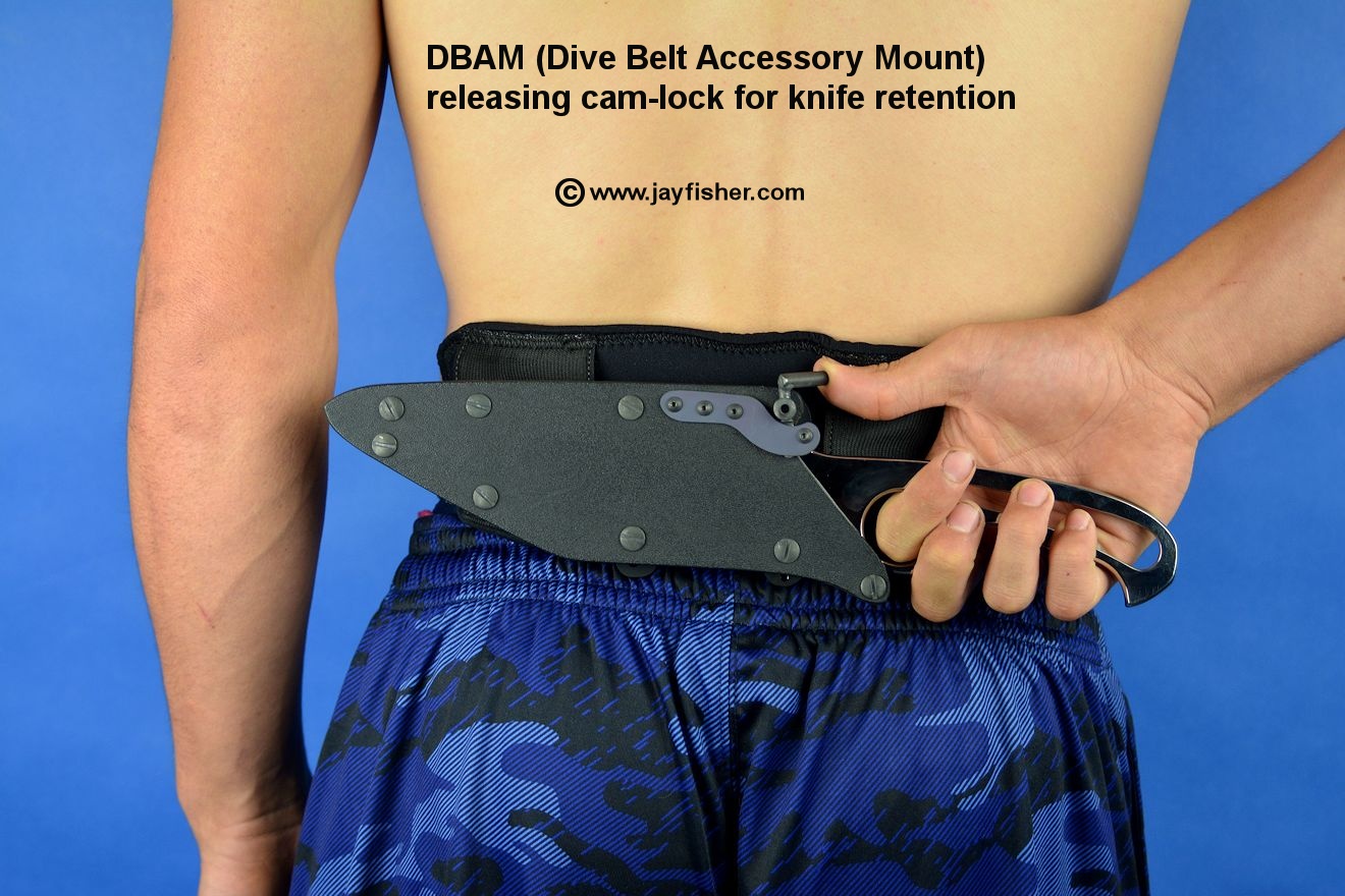 DBAM (Dive Belt Accessory Mount). Release is being operated by thumb pressure on cam lock.
