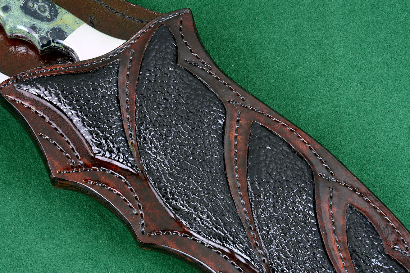 "Ananke" knife sheath detail view of buffalo skin inlays in hand-carved leather with hand-stitching