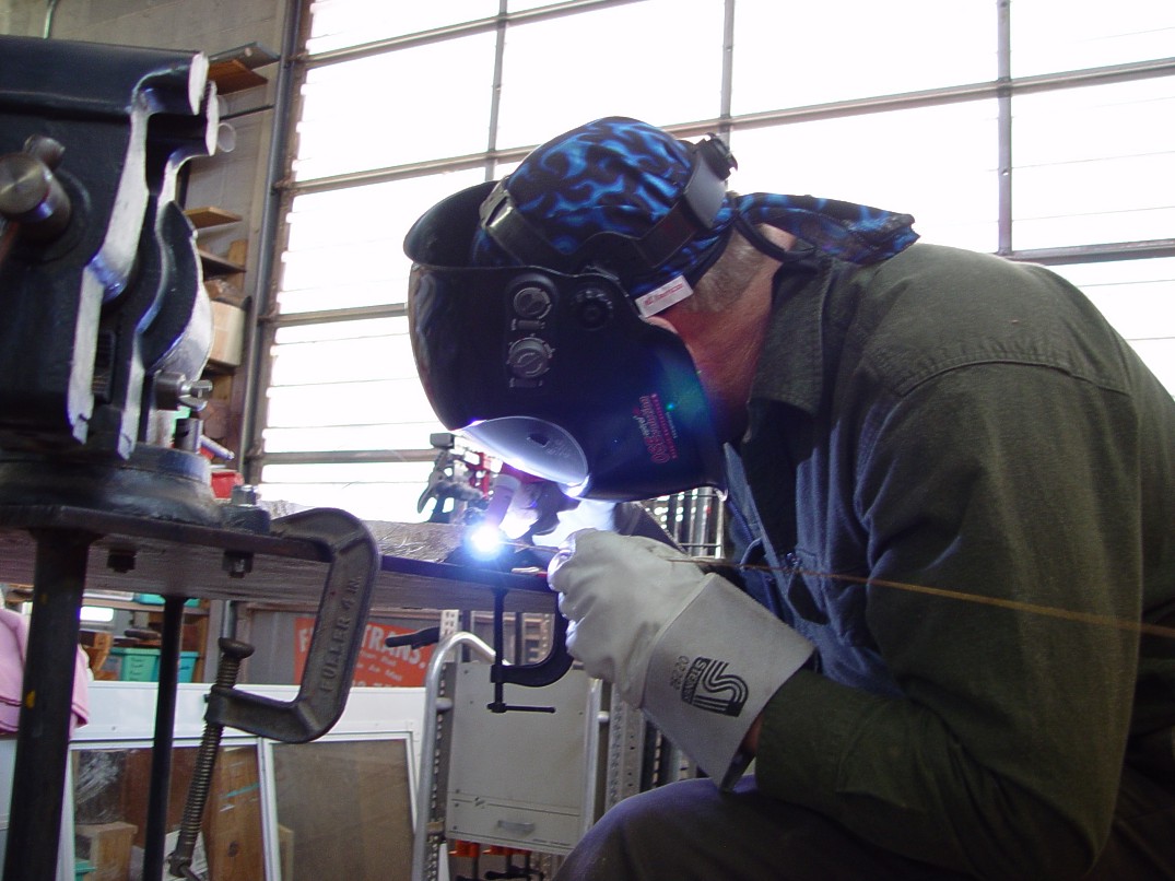 Gas tungsten arc welding in high tech modern art studio and machine shop