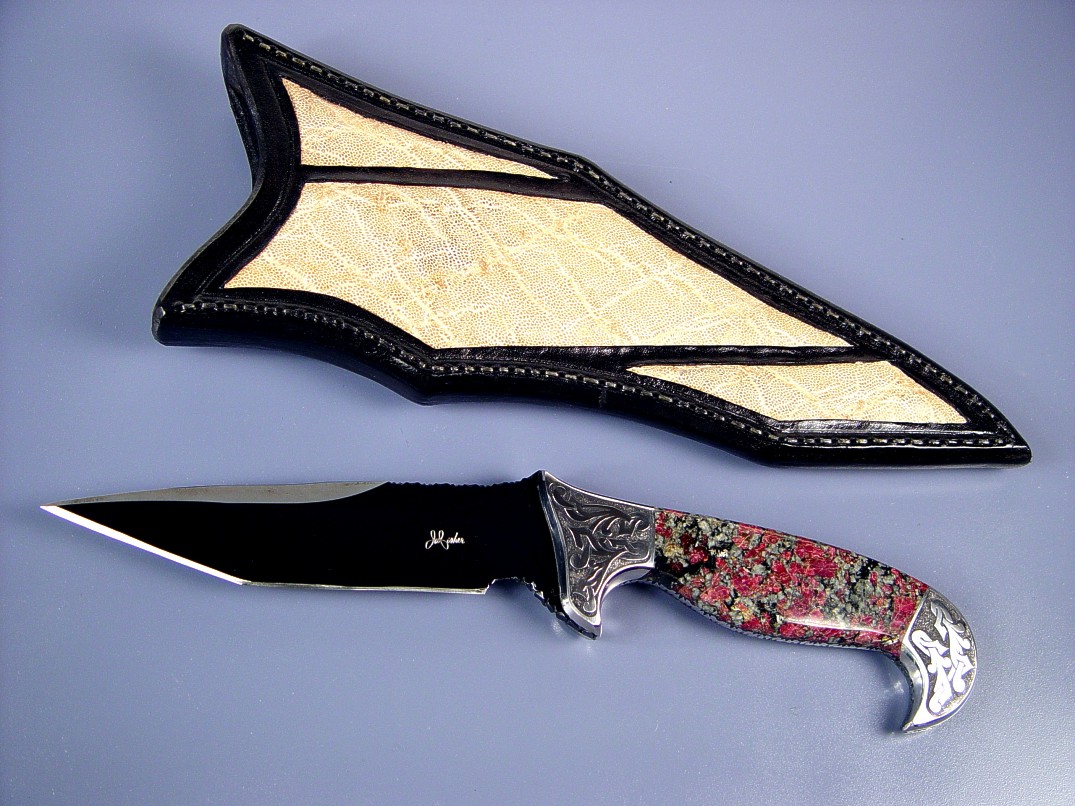 Fine handmade knife: "Mercury Magnum" obverse side view: blued O-1 high carbon alloy tool steel blade, hand-engraved 304 stainless steel bolsters, Eudialite gemstone handle, Elephant skin inalid in hand-carved leather sheath