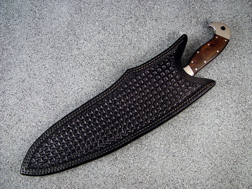 Heavy hand-tooled and stamped khukri sheath in leather shoulder, double stitched with polyester sinew for large khukri