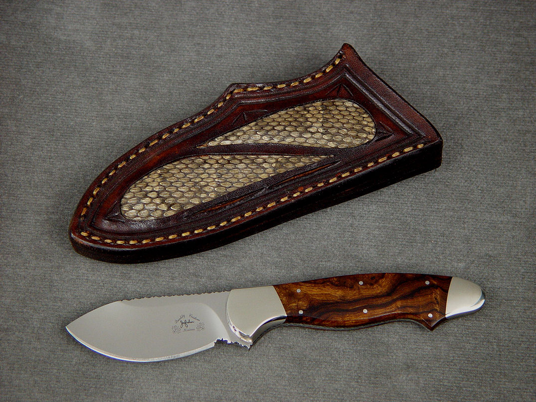 "Pluto" obverse side view in 440C high chromium stainless steel blade, nickel silver bolsters, Desert Ironwood hardwood handle, hand-carved leather sheath inlaid with Prairie Rattlesnake skin