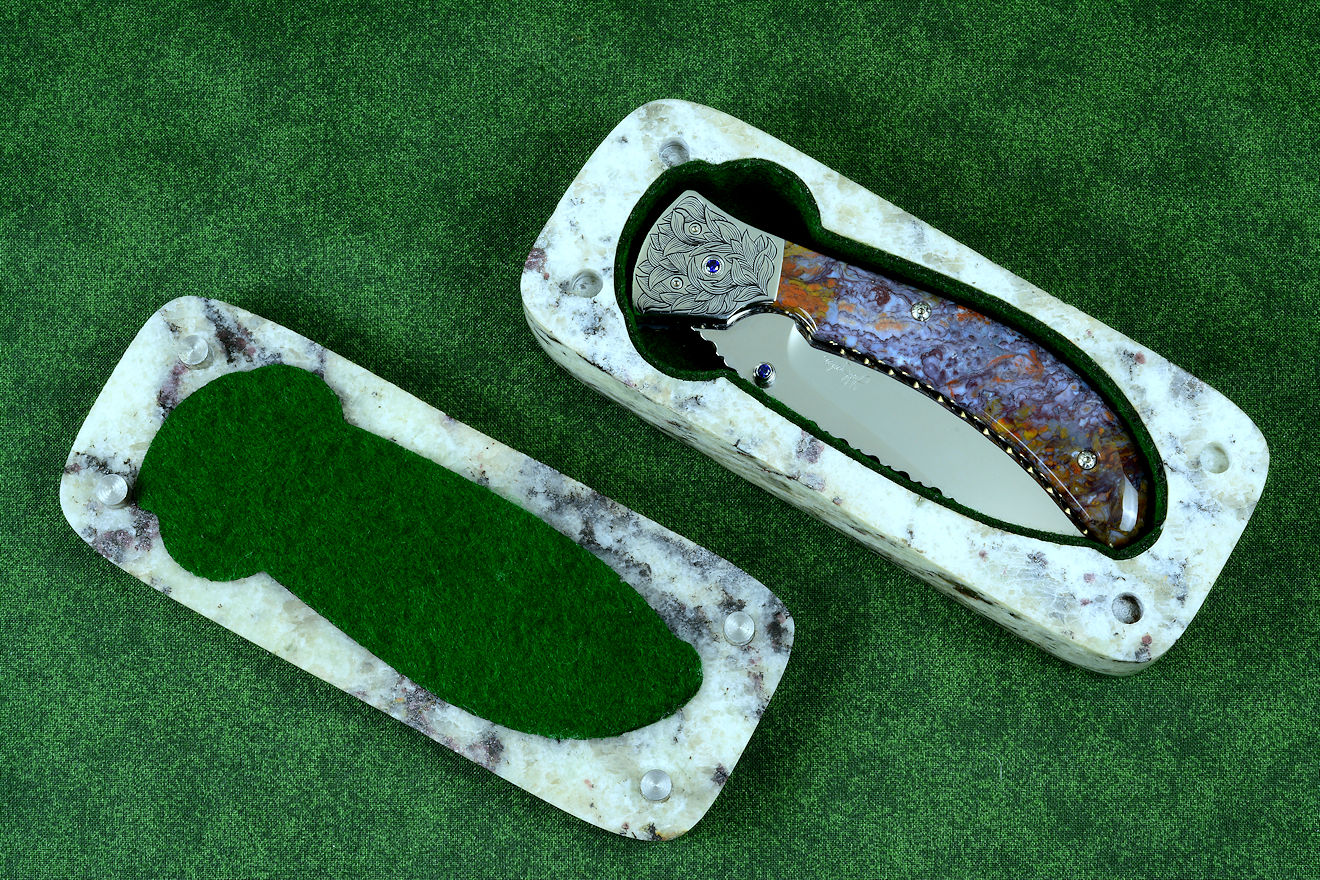 "Starling" granite with garnets and hornblende stone sarcophagus case with cabochons of Rio Grande Agate gemstone and stainless steel pins, polyester felt lining "Starling" granite with garnets and hornblende stone sarcophagus case with cabochons of Rio Grande Agate gemstone and stainless steel pins, polyester felt lining