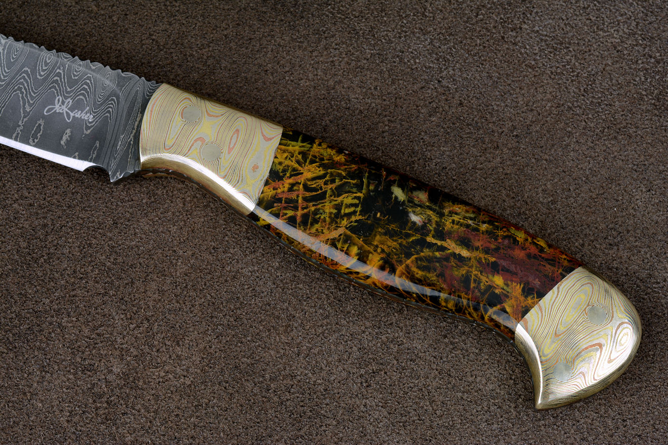 "Tarazed" in stainless steel pattern welded damascus blade, mokume gane diffusion welded and forged bolsters, Pilbara Picasso Jasper gemstone handle, hand-carved leather sheath inlaid with ostrich leg skin