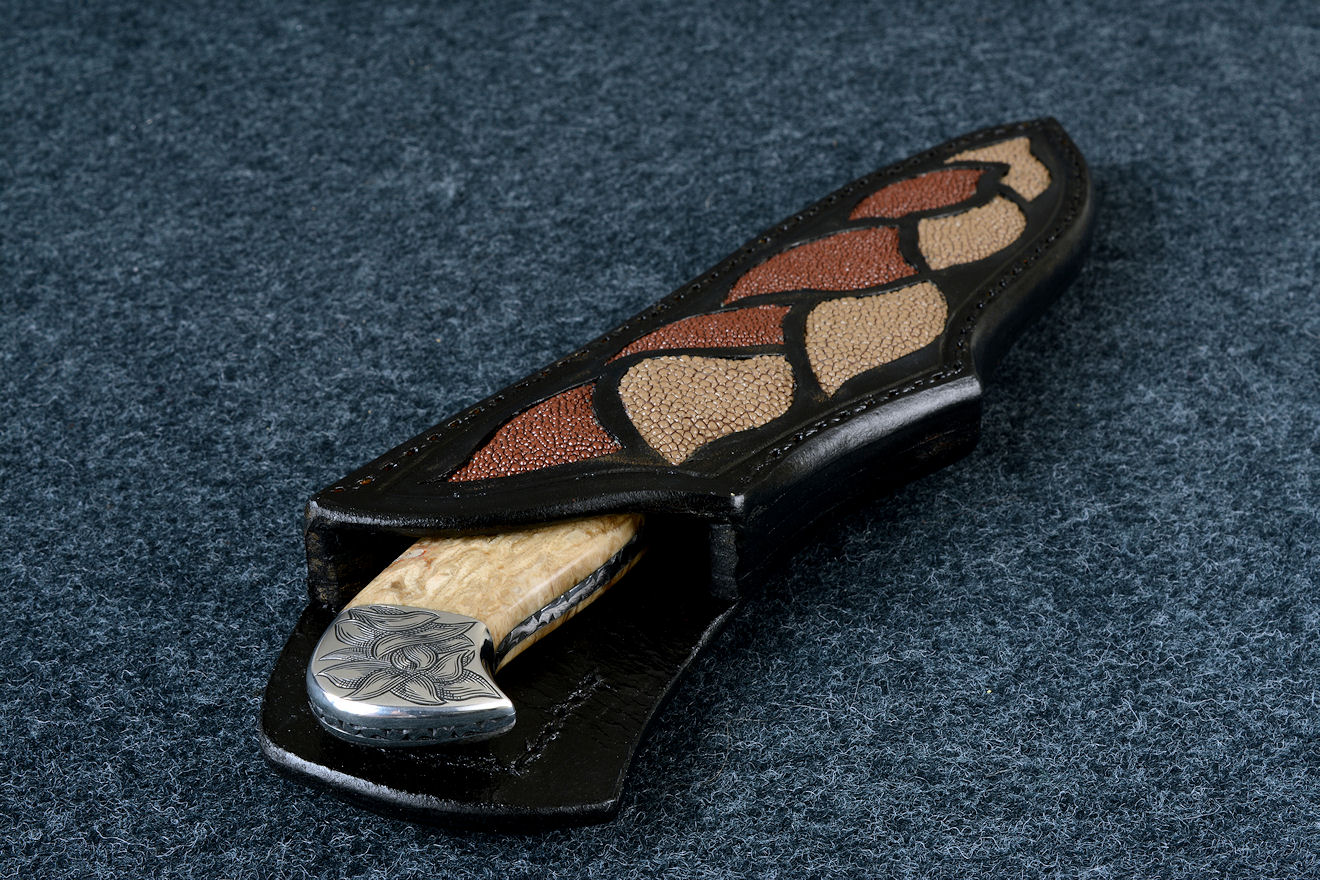 "Vulpecula" obverse side view in D2 extremely high carbon die steel blade, hand-engraved 304 stainless steel bolsters, Petrified Fern fossil gemstone handle, hand-carved leather sheath inlaid with rayskin