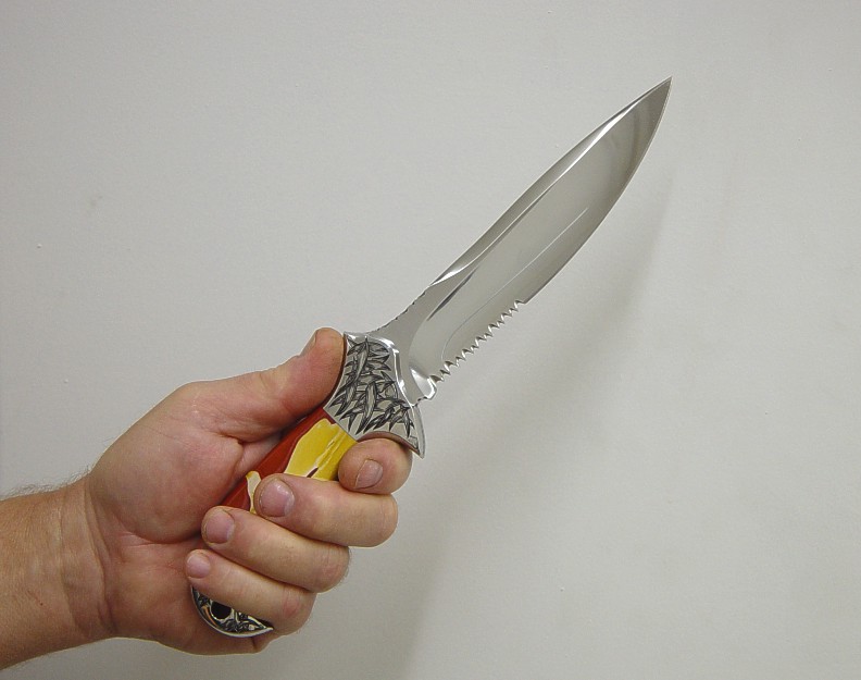Gripping the knife, the hand to blade union. Forward Saber grip shown