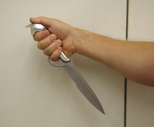 Unusual knife grip technique: Reverse grip, talon leading, finger ring