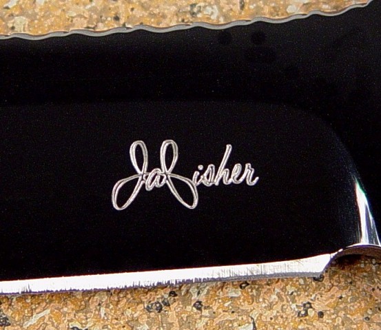 Knife maker's mark of Jay Fisher diamond engraved on mirror finished blued O-1 tungsten-vanadium tool steel blade
