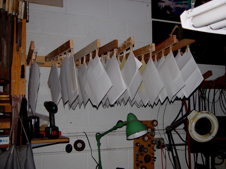 The order rack in the studio. Some of these pages have five knives on the page, and there are twice as many pages in the office, waiting to get on the rack. Whew!