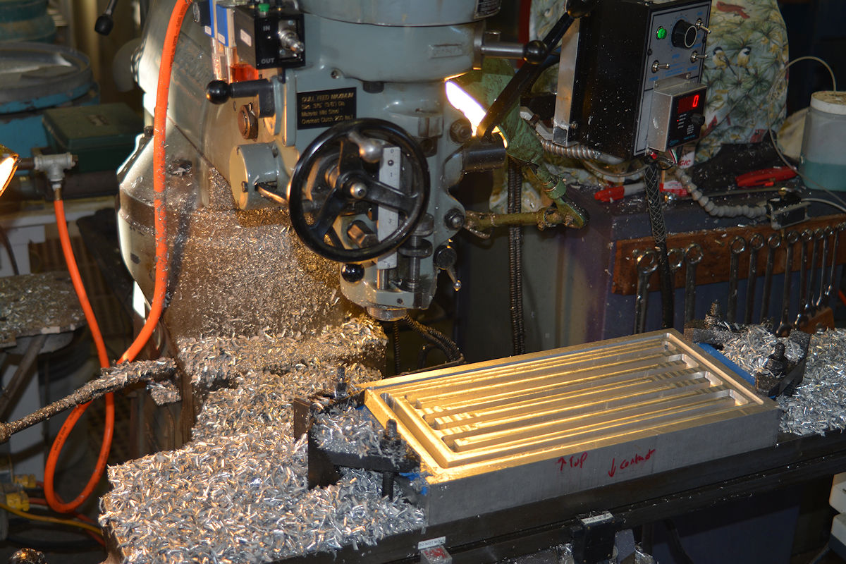Milling the heat exchanger pathways in a contact quenching block of aluminum