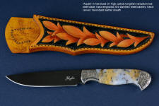 "Aquila" obverse side view in mirror polished and hot blued O1 high carbon tungsten-vandium tool steel blade, hand-engraved 304 stainless steel bolsters, Golden Plume Agate gemstone handle, hand-carved, hand-dyed leather sheath