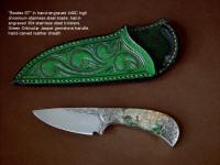 "Bootes ST" obverse side view in hand-engraved 440C high chromium stainless steel blade, hand-engraved 304 stainless steel bolsters, Green Orbicular Jasper gemstone handle, hand-carved leather sheath