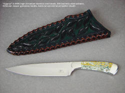"Cygnus" obverse side view in 440C high chromium stainless steel blade, 304 stainless steel bolsters, Orbicular Jasper gemstone handle, hand-carved, tooled, and laced leather sheath