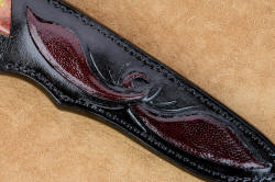 "Aldebaran" sheath front panel inlay detail. Hand-carved pockets are inlaid with ostrich skin, design is the same as on the bolster engraving.