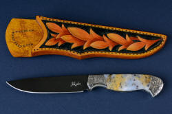 "Aquila" obverse side view. This shot has the white reflector to illustrate the grind lines.Blade is hot-blued O1 tungsten-vanadium tool steel, with hand-engraved 304 stainless steel bolsters, and Golden Plume Agate gemstone handle with hand-carved, hand-dyed leather sheath