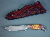 "Izar" obverse side view, knife in 440C high chromium stainless steel blade, hand-engraved 304 stainless steel bolsters, Sunset Jasper gemstone handle, hand-carved leather sheath