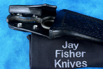 "Kairos" Tactical, Counterterrorism Knife, details of leather tab lock sheath,  in T3 cryogenically treated 440C high chromium martensitic stainless steel blade, 304 stainless steel bolsters, blue and black G10 fiberglass epoxy composite handle, hybrid tension-locking tab-lock sheath in kydex, anodized aluminium, stainless steel and titanium