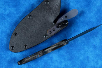 "Kairos" Tactical, Counterterrorism Knife, inside handle tang view in T3 cryogenically treated 440C high chromium martensitic stainless steel blade, 304 stainless steel bolsters, blue and black G10 fiberglass epoxy composite handle, hybrid tension-locking tab-lock sheath in kydex, anodized aluminium, stainless steel and titanium