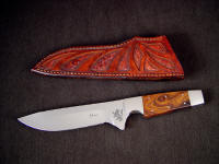 "Paraeagle" fine tactical knife in 440c high chromium stainless steel blade, custom etched, 304 stainless steel bolsters, Desert Ironwood handle, hand-carved and tooled leather sheath