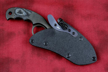 "Skeg"  tactical, counterterrorism, crossover knife, sheathed view in ATS-34 high molybdenum martensitic stainless steel blade, 304 stainless steel bolsters, black and gray G10 fiberglass/epoxy composite handle, hybrid tension tab-locking sheath in kydex, anodized aluminum, black oxide stainless steel and anodized titanium