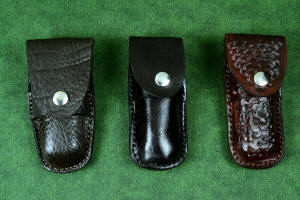 "Starling" fine handmade custom folding knife sheaths in American Bison (Buffalo) skin, black patent leather, and brown camouflage leather and stainless steel "Starling" fine handmade custom folding knife sheaths in American Bison (Buffalo) skin, black patent leather, and brown camouflage leather and stainless steel