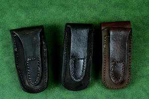 "Starling" fine handmade custom folding knife sheaths in American Bison (Buffalo) skin, black patent leather, and brown camouflage leather and stainless steel "Starling" fine handmade custom folding knife sheaths in American Bison (Buffalo) skin, black patent leather, and brown camouflage leather and stainless steel