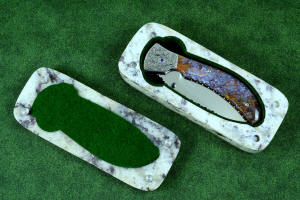 "Starling" granite with garnets and hornblende stone sarcophagus case with cabochons of Rio Grande Agate gemstone and stainless steel pins, polyester felt lining "Starling" granite with garnets and hornblende stone sarcophagus case with cabochons of Rio Grande Agate gemstone and stainless steel pins, polyester felt lining