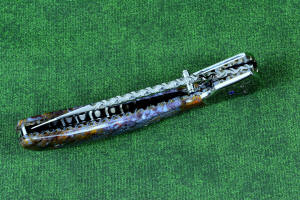 "Starling" fine handmade custom folding knife, liner and blade filework detail. Note differentially anodized blue and gold titanium liners and full fine filework throughout "Starling" fine handmade custom folding knife, liner and blade filework detail. Note differentially anodized blue and gold titanium liners and full fine filework throughout