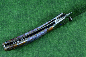 "Starling" fine handmade custom folding knife, lock view,  liner and blade filework detail. Note differentially anodized blue and gold titanium liners and full fine filework throughout "Starling" fine handmade custom folding knife, lock view,  liner and blade filework detail. Note differentially anodized blue and gold titanium liners and full fine filework throughout