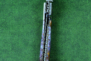 "Starling" fine handmade custom folding knife, inside spine filework view, liner and blade filework detail. Note differentially anodized blue and gold titanium liners and full fine filework throughout "Starling" fine handmade custom folding knife, inside spine filework view, liner and blade filework detail. Note differentially anodized blue and gold titanium liners and full fine filework throughout