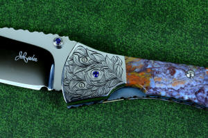 "Starling" fine handmade custom folding knife, maker's mark and obverse side detail with hand-engraved bolsters and blue amethyst faceted gemstone fittings "Starling" fine handmade custom folding knife, maker's mark and obverse side detail with hand-engraved bolsters and blue amethyst faceted gemstone fittings